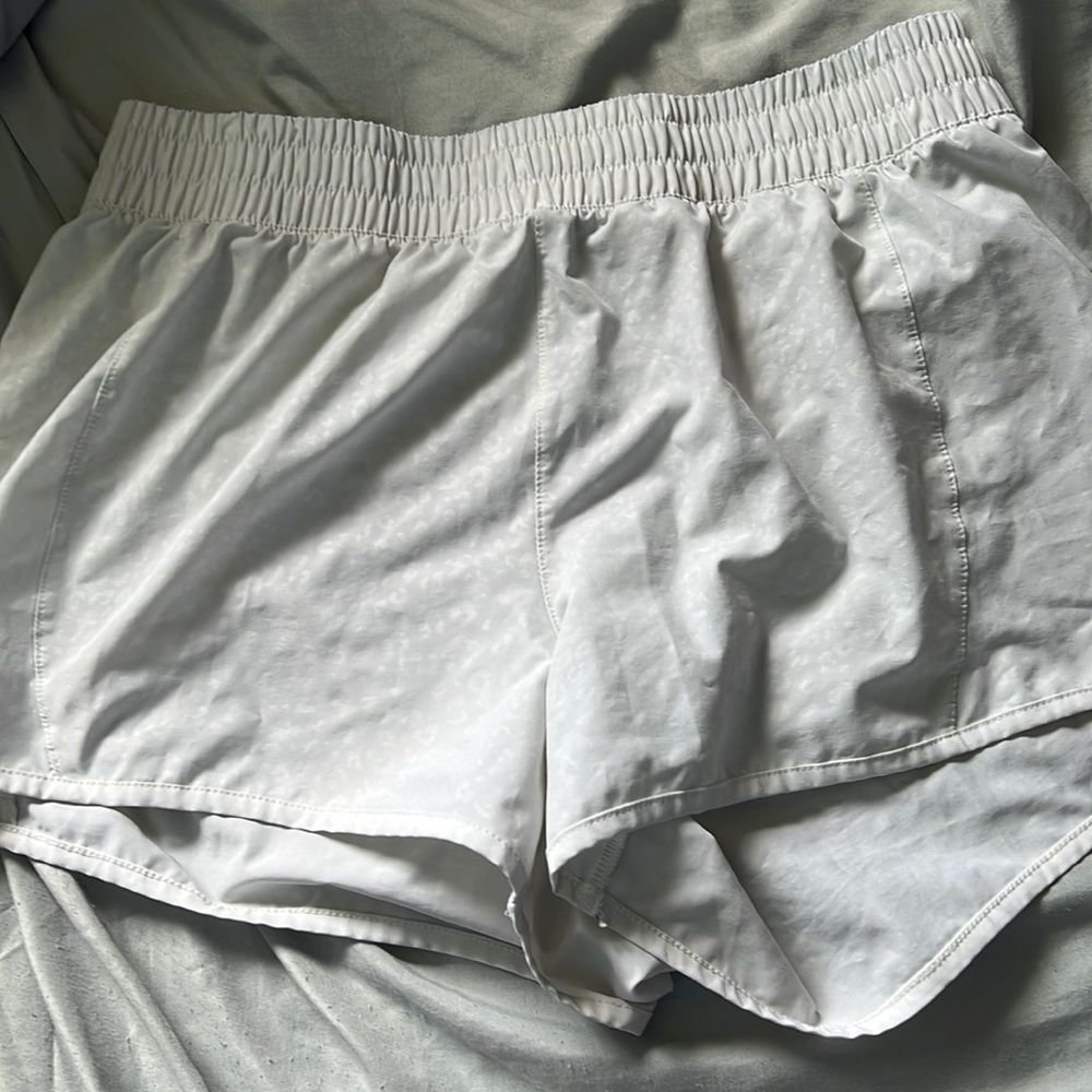 super cute white shorts with white cheetah detailing
